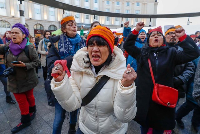 Women's rights activists shout during a gathering on the street on International Women's Day in Brussels, Belgium March 8, 2018. REUTERS/Yves Herman