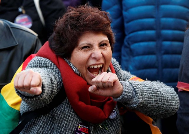 A women's rights activist takes part in a gathering on the street on International Women's Day in Brussels, Belgium March 8, 2018. REUTERS/Yves Herman