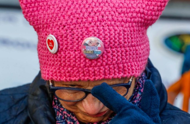 REFILE - CORRECTING TYPO A women's rights activist takes part in a gathering on the street on International Women's Day in Brussels, Belgium March 8, 2018. REUTERS/Yves Herman