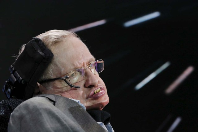 FILE PHOTO: Physicist Stephen Hawking sits on stage during an announcement of the Breakthrough Starshot initiative with investor Yuri Milner in New York April 12, 2016. REUTERS/Lucas Jackson/File Photo