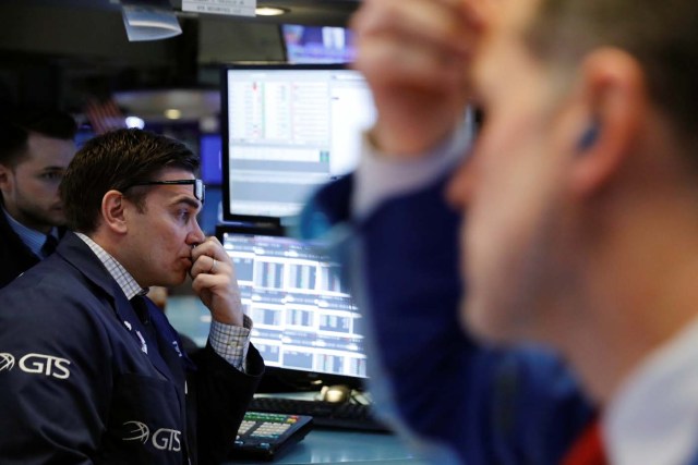 Traders work on the floor of the New York Stock Exchange shortly after the opening bell in New York, U.S., March 1, 2018. REUTERS/Lucas Jackson