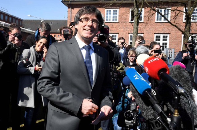 Catalonia's former leader Carles Puigdemont talks to the media as he leaves the prison in Neumuenster, Germany, April 6, 2018. A German court on Thursday rejected an extradition request for Puigdemont on the charge of rebellion for his role in the campaign for the region's independence. REUTERS/Fabian Bimmer