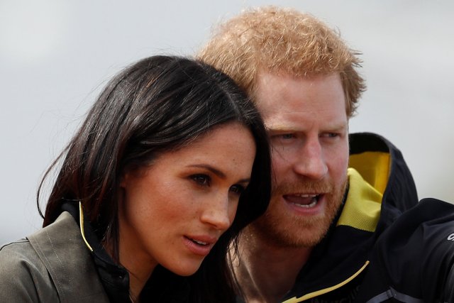 Britain's Prince Harry, Patron of the Invictus Games Foundation, and Meghan Markle watch athletes at the team trials for the Invictus Games Sydney 2018 at the University of Bath Sports Training Village in Bath, Britain, April 6, 2018. REUTERS/Peter Nicholls