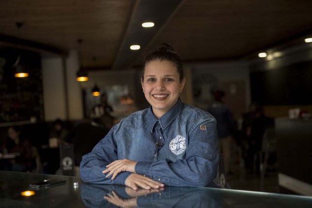 Venezuelan Matilde Carruyo poses inside the restaurant she manages, in Santiago, on May 14, 2018. Exiled Venezuelans have no expectations of the presidential election taking place next May 20 in their home country. / AFP PHOTO / Martin BERNETTI