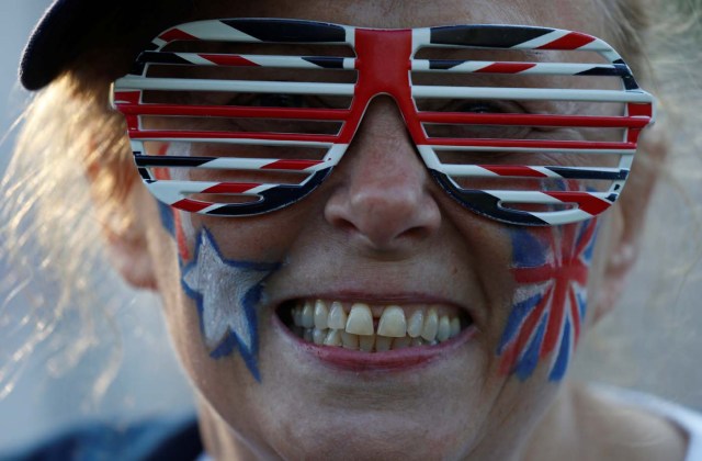 A woman smiles ahead of the wedding of Britain’s Prince Harry to Meghan Markle in Windsor, Britain, May 19, 2018. REUTERS/Damir Sagolj