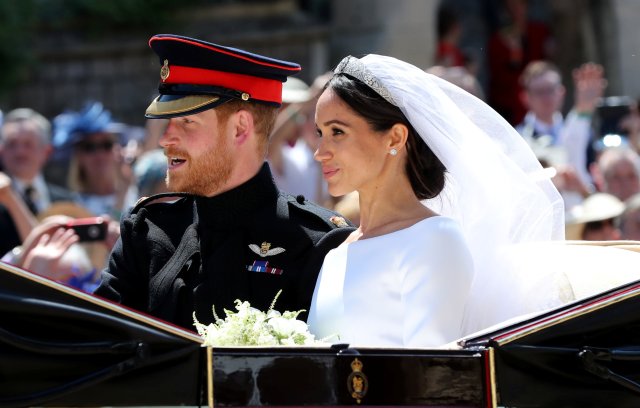 Meghan Markle and Prince Harry leave St George's Chapel at Windsor Castle after their wedding in Windsor, Britain, May 19, 2018. Gareth Fuller/Pool via REUTERS